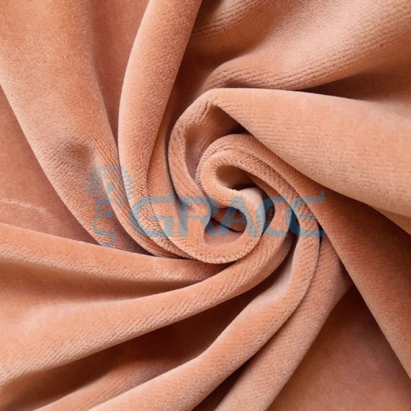 Ткань велюр - натуральная трикотажная, эластичная в розово-оранжевом цвете